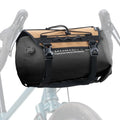Black and beige bike bag attached to a bicycle on a white background