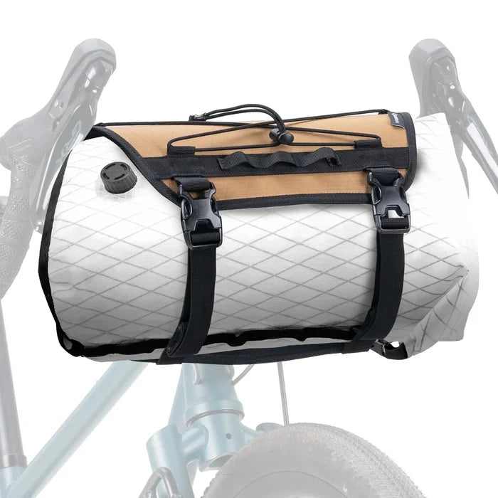 Bicycle with a white and tan roll-top bag on a white background