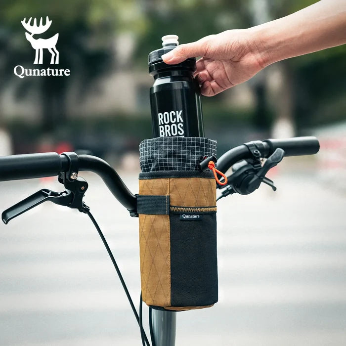 A black water bottle is being put into a khaki water bottle bag with a drawstring
