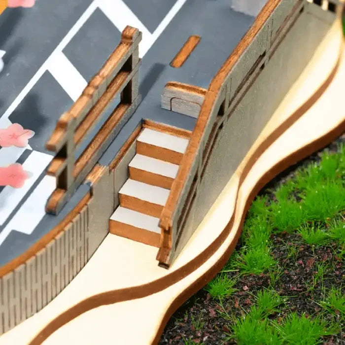 Modèle architectural montrant des escaliers et des rampes avec des éléments de design incurvés.
